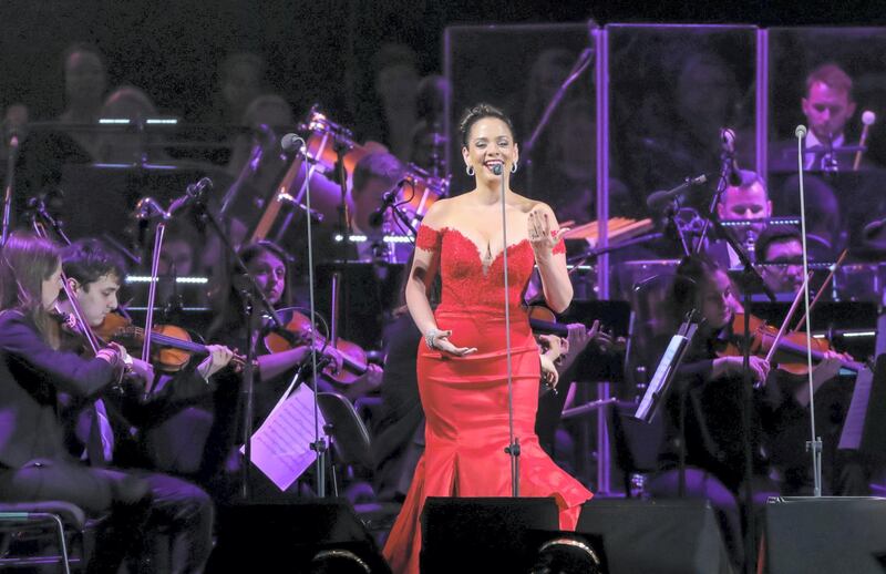 Soprano soloist Maria Ada joins Bocelli on stage during performance at du Arena.