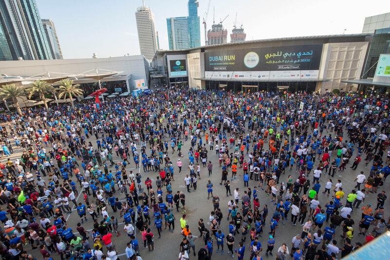 Dubai, United Arab Emirates - Participants after their run at the Dubai 30x30 Run at Sheikh Zayed Road.  Leslie Pableo for The National