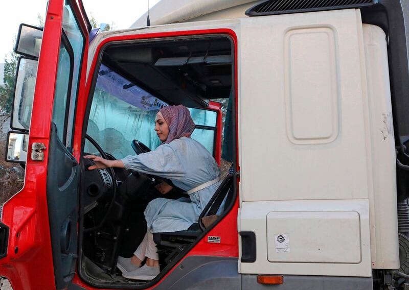 Palestinian Dalia Al Darawish prepares for her exam to become a lorry driver, in the West Bank town of Hebron. AFP