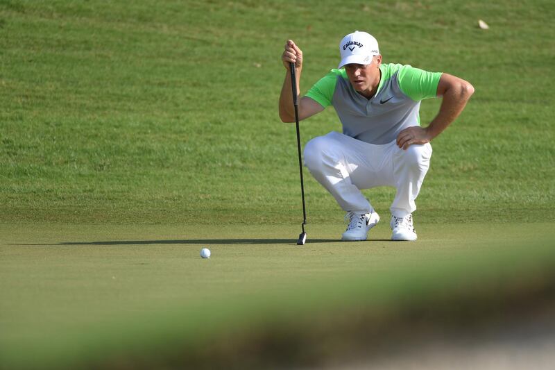 Alex Noren lines up a putt on the 7th green during the second round of the DP World Tour Championship. Ross Kinnaird / Getty Images