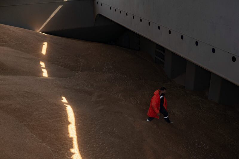 A crew member prepares a grain analysis as part of a UN inspection. AFP