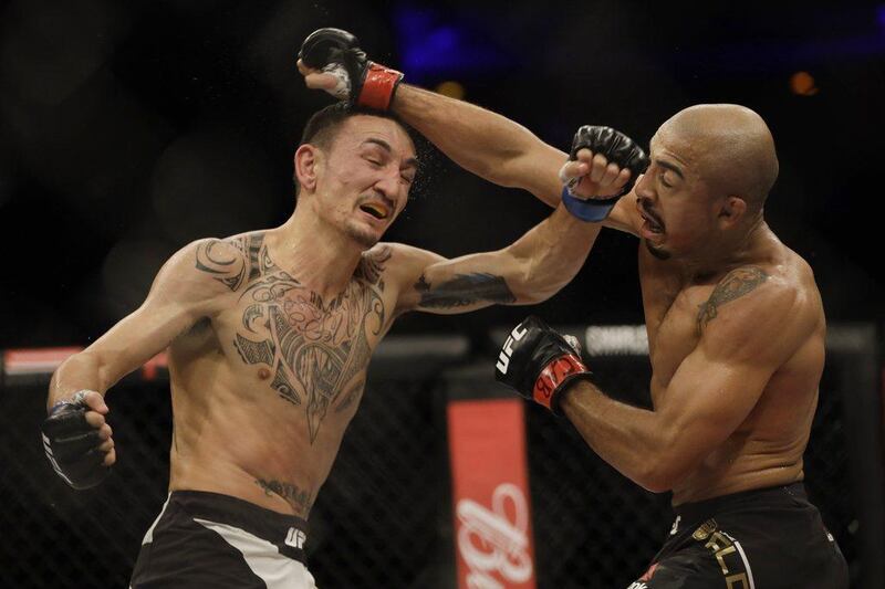 Jose Aldo, left, trades punches with Max Holloway during their UFC Featherweight bout in Rio de Janeiro, Brazil, early Sunday, June 4, 2017. Leo Correa / AP Photo