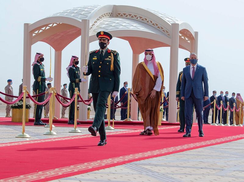 Saudi Crown Prince Mohammed bin Salman, center right, accompanies Iraqi Prime Minister Mustafa Al Kadhimi on the red carpet on his arrival to Riyadh International Airport, in Saudi Arabia.  Riyadh committed to a $3bn fund for development of critical projects in Iraq. AP