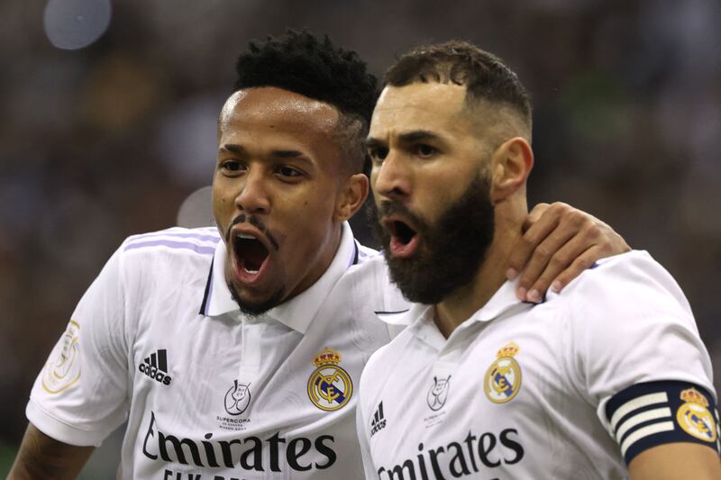 Karim Benzema celebrates with Eder Militao after scoring the opening goal. AFP