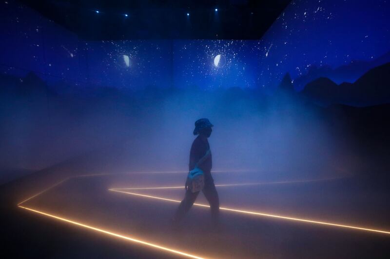 People visit the Swiss pavilion and make their way through the Sea of fog which signifies the trip up the mountains on the 5th day of Expo 2020, Dubai.