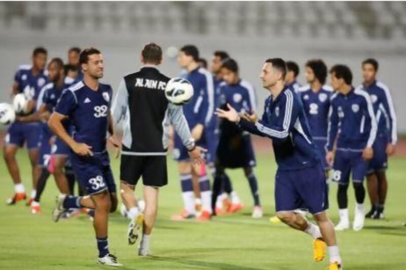 Matei Mirel Radoi, front right, and the rest of Al Ain team on the training pitch. Little can prepare them for the 100,000 hostile Iranian fans that will pack Esteghlal's Azadi Stadium in Tehran.