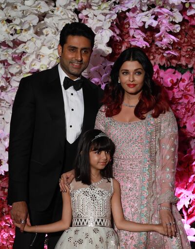 epa08541368 (FILE) - Bollywood actors Abhishek Bachchan and his wife Aishwarya Rai  Bachchan pose with their daughter Aaradhya as they arrive to attend the wedding reception of Akash Ambani, son of Reliance Industries Chairman Mukesh Ambani, in Mumbai, India, 10 March 2019 (reissued 12 July 2020). According to media reports, Bollywood actor Amitabh Bachchan, 77, has tested positive for COVID-19 and has been admitted to a hospital in Mumbai. His son, Abhishek, 44, has also been taken to a Mumbai hospital showing mild symptoms, media added.  EPA/DIVYAKANT SOLANKI