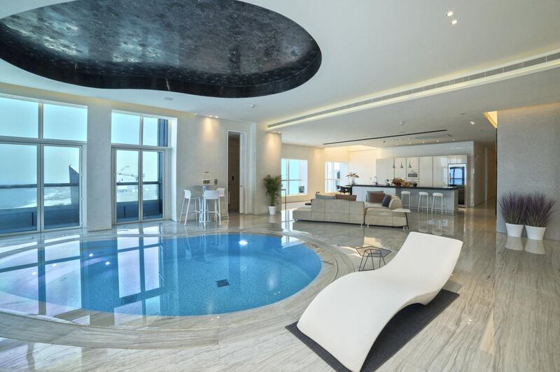 The swimming pool takes centre stage in the living room. Courtesy Allsopp and Allsopp