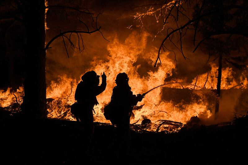 Firefighters battle a blaze east of Oroville, California. Noah Berger / Reuters