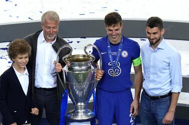 Chelsea owner Roman Abramovich (2nd left) poses with club captain Cesar Azpilicueta and the trophy after the UEFA Champions League final match held at Estadio do Dragao in Porto, Portugal. Picture date: Saturday May 29, 2021. PA Photo. See PA story SOCCER Final. Photo credit should read: Adam Davy/PA Wire. Editorial use only, no commercial use without prior consent from rights holder.