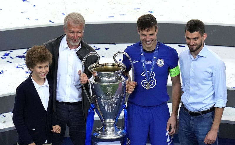 Chelsea owner Roman Abramovich (2nd left) poses with club captain Cesar Azpilicueta and the trophy after the UEFA Champions League final match held at Estadio do Dragao in Porto, Portugal. Picture date: Saturday May 29, 2021. PA Photo. See PA story SOCCER Final. Photo credit should read: Adam Davy/PA Wire.Editorial use only, no commercial use without prior consent from rights holder.