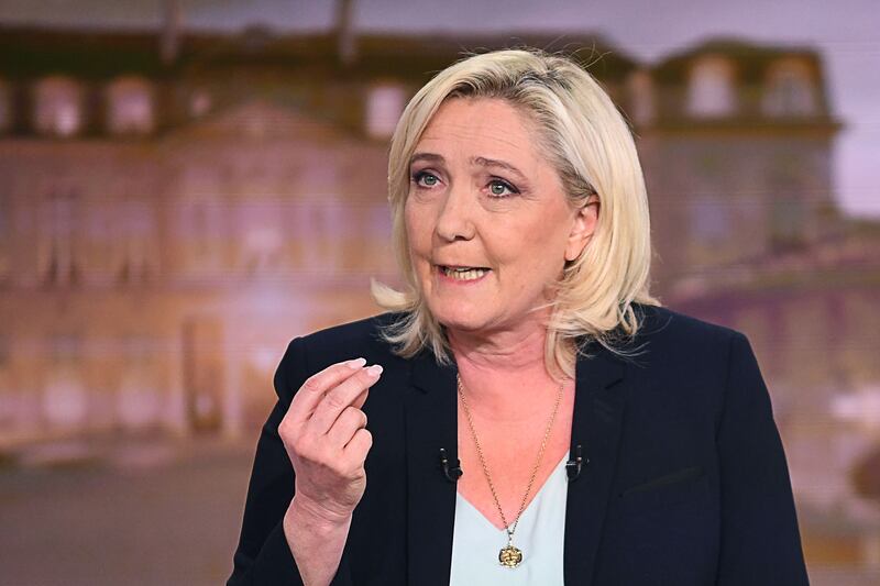 Ms Le Pen make the evening news, in Boulogne-Billancourt near Paris. AFP