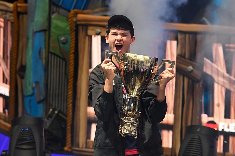 Jul 28, 2019; Flushing, NY, USA; Bugha celebrates his win as the first solo World Champion at the Fortnite World Cup Finals e-sports event at Arthur Ashe Stadium. Mandatory Credit: Dennis Schneidler-USA TODAY Sports     TPX IMAGES OF THE DAY