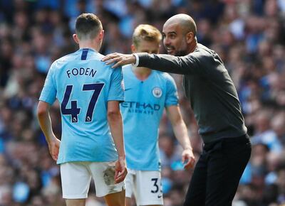 Soccer Football - Premier League - Manchester City v Tottenham Hotspur - Etihad Stadium, Manchester, Britain - April 20, 2019  Manchester City's Phil Foden is substituted off as Manchester City manager Pep Guardiola looks on              Action Images via Reuters/Jason Cairnduff  EDITORIAL USE ONLY. No use with unauthorized audio, video, data, fixture lists, club/league logos or "live" services. Online in-match use limited to 75 images, no video emulation. No use in betting, games or single club/league/player publications.  Please contact your account representative for further details.
