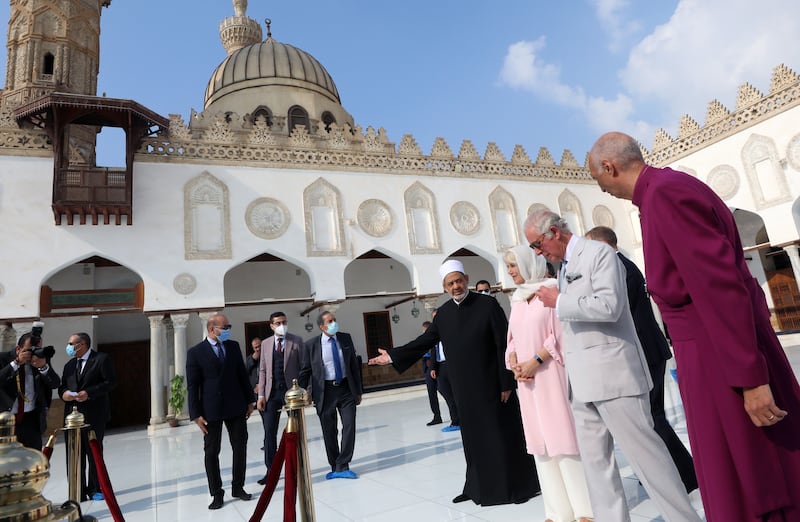 The Grand Imam invites Prince Charles and his wife Camilla to the courtyard of the mosque.  EPA