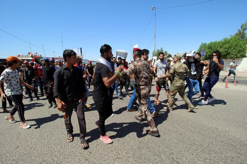 Iraqi demonstrators gather during an anti-government protest in front of the Governorate building in Basra, Iraq. Reuters