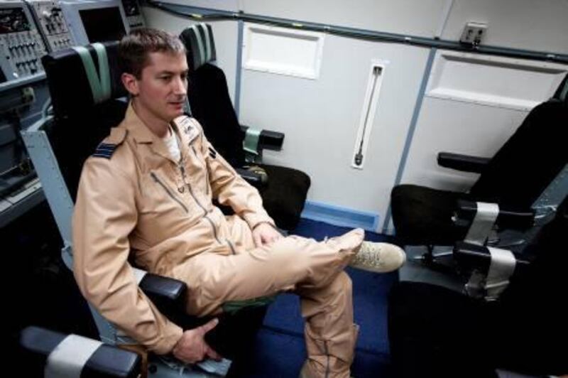 November 30, 2010 - Abu Dhabi, UAE - Paul Moss, Wing Commander of 8 Squadron in the British Royal Air Force sits in an AWACS at Al Dharfa Air Base.  The British Royal Air Force and United Arab Emirates Air Force flew in joint maneuvers on Tuesday November 30, 2010 at Al Dhafra Air Base in Abu Dhabi.  The UK used the Eurofighter Typhoon, a twin - engine, canard-delta wing, multirole aircraft while the UAE used the F16 and Mirage aircrafts.   (Andrew Henderson/The National)