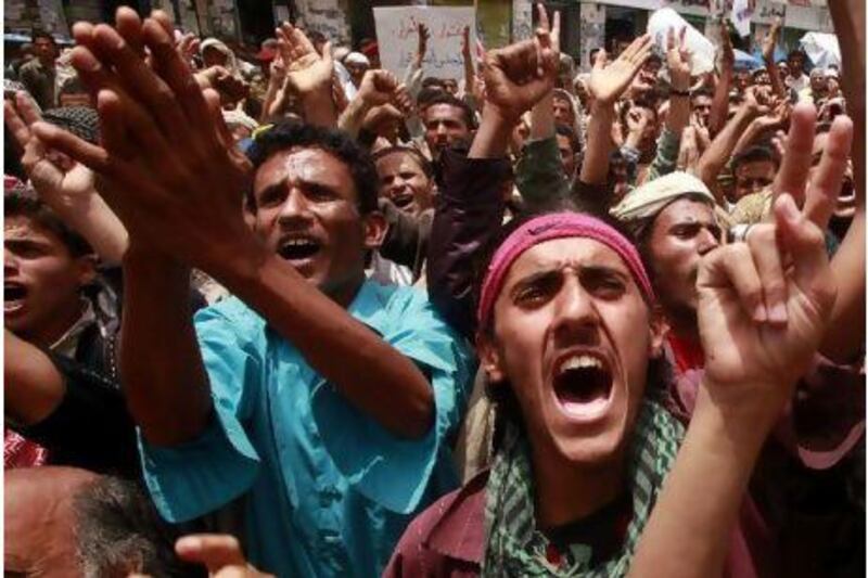 Anti government protesters take part in a rally to demand the departure of Yemen's President Ali Abdullah Saleh at Tagheer square in Sanaa yesterday. Suhaib Salem / Reuters