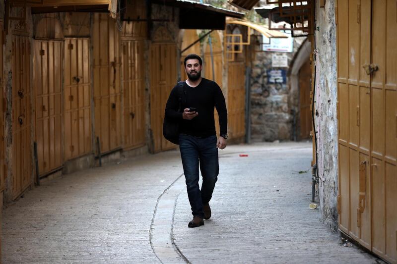 A view of empty street and closed shops in Hebron.  EPA