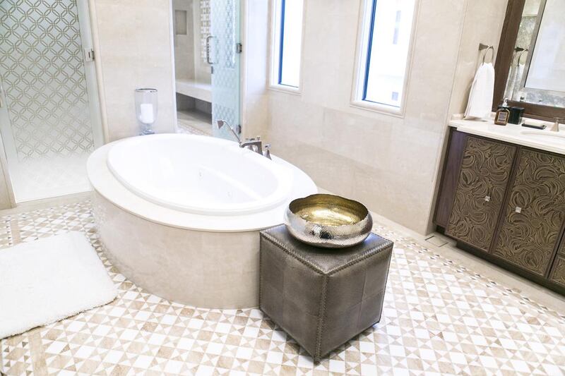 The master bedroom's bathroom, above, in one of villas at Dubai Hills. Reem Mohammed / The National