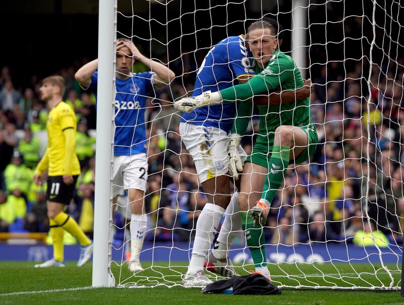 Everton goalkeeper Jordan Pickford celebrates after his save from Cesar Azpilicueta. PA