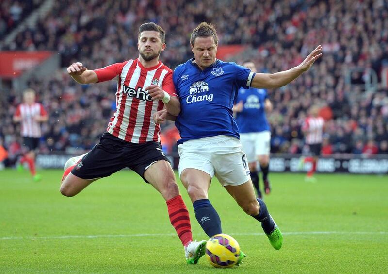 Southampton striker Shane Long, left, vies with Everton defender Phil Jagielka during their English Premier League match at St Mary's Stadium in Southampton, England, on December 20, 2014. Glyn Kirk / AFP