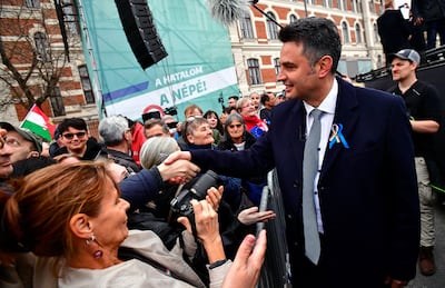 Opposition candidate Peter Marki-Zay shakes hands with a supporter at a demonstration in Budapest. Reuters 