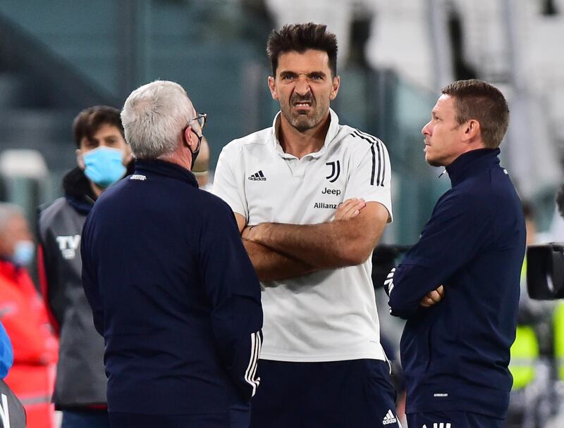 Juventus goalkeeper Gianluigi Buffon out on the Allianz Stadium pitch as players and officials await word of Napoli's no-show. Reuters