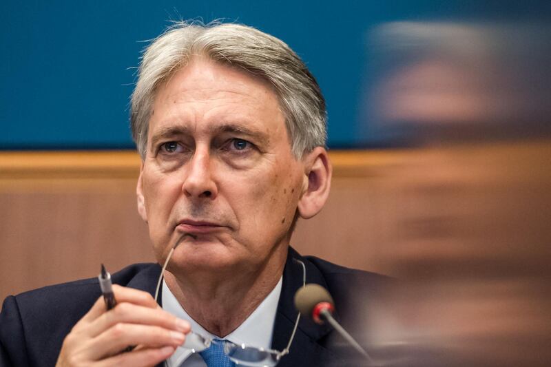 Philip Hammond, U.K. chancellor of the exchequer, pauses during a panel discussion at the Asian Infrastructure Investment Bank (AIIB) annual meeting in Luxembourg, on Friday, July 12, 2019. Luxembourg is hosting AIIB's first annual meeting to be held outside Asia. Photographer: Geert Vanden Wijngaert/Bloomberg