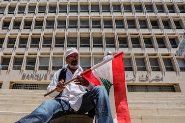 A retired army sits in front of the Lebanese Central Bank during a protest earlier this month. Public employees and military veterans fear that a new budget will include austere salary cuts, pension reductions and tax increases. Photo: EPA/Nabil Mounzer