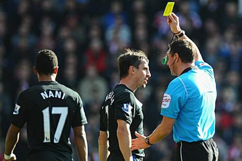 Gary Neville, centre, was lucky to see yellow instead of red against Stoke City at the weekend for a reckless challenge on Matthew Etherington.