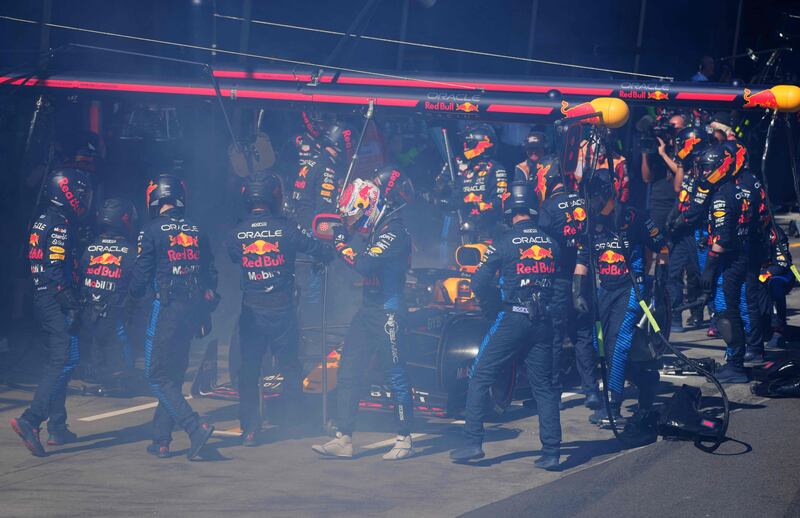 Max Verstappen walks back to the garage after smoke billowed from his car during the Australian Grand Prix. AFP