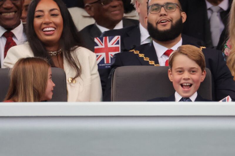 Princess Charlotte and Prince George, right, enjoying the Platinum Party at the Palace.  Reuters