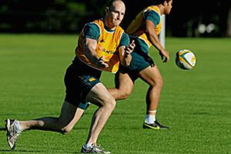 The Australia captain Stirling Mortlock competes in drills during a training session in Sydney.