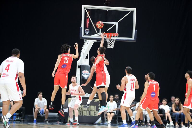 Egypt (in red) take on Lebanon (white) during the International Basketball Week in Abu Dhabi on August 17 2023.  Pawan Singh / The National
