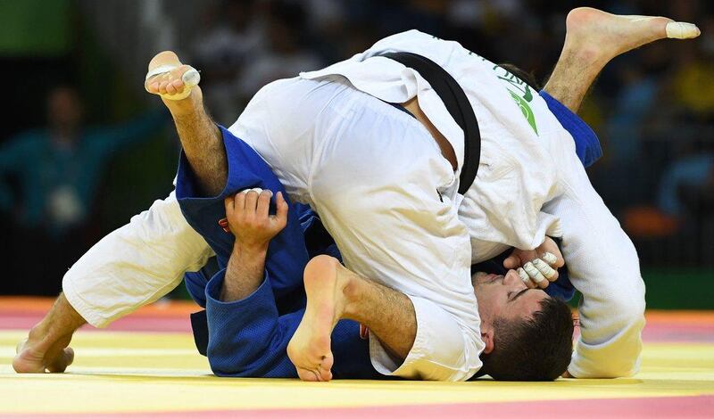 UAE’s Sergiu Toma in action against Italy’s Matteo Marconcini during their men’s 81kg judo bronze medal A match of the Rio 2016 Olympic Games in Rio de Janeiro on August 9, 2016. Tosifhumi Kitamura / AFP