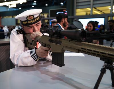 A member of the Chinese navy at the Caracal display at the International Defence Exhibition. Victor Besa / The National