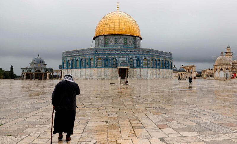 A Palestinian walks near the The Dome of the Rock mosque in Jerusalem. AFP