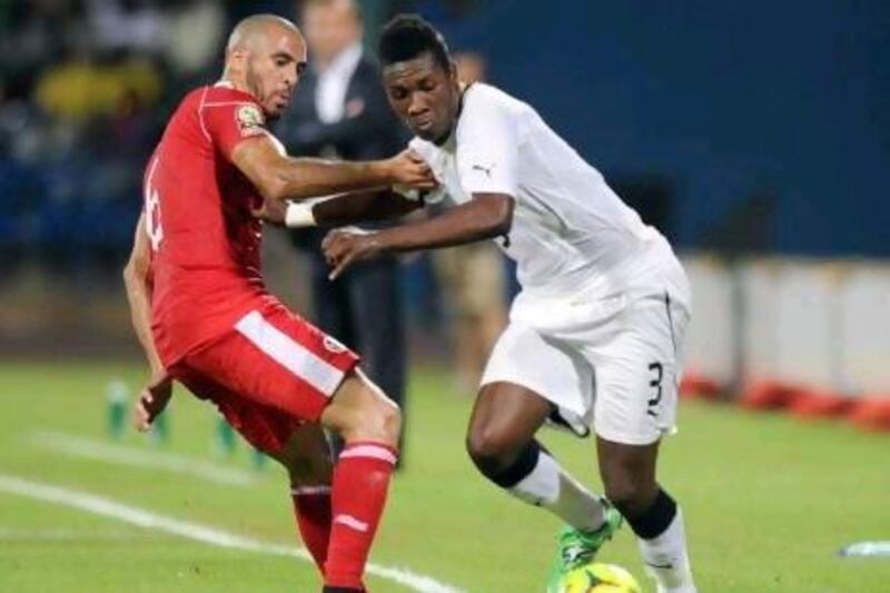 Asamoah Gyan, right, has decided to take "an extended break" from international football.