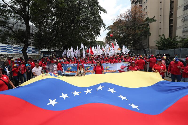 Hundreds of people participate in an official march against imperialism and sabotage of the electrical grid, in Caracas, Venezuela. EPA