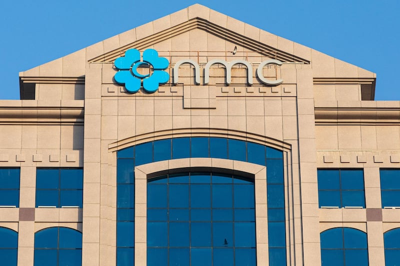 A logo sits on display outside the NMC Speciality Hospital, operated by NMC Health Plc, in Abu Dhabi, United Arab Emirates, on Sunday, March 1, 2020. Troubled NMC Health Plc, the largest private health-care provider in the United Arab Emirates, asked lenders for an informal standstill on its debt as Abu Dhabi weighs an injection of capital to safeguard the emirate’s reputation among global investors. Photographer: Christopher Pike/Bloomberg