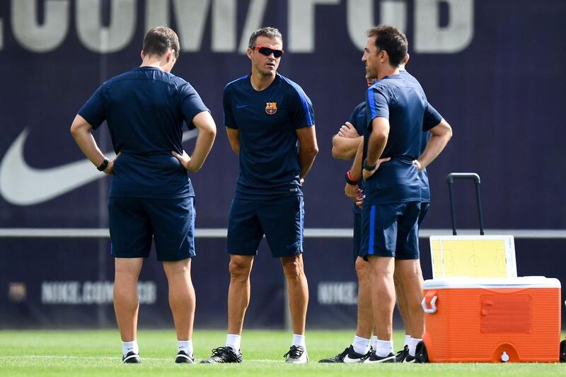 Manager Luis Enrique, centre, looks on. David Ramos / Getty Images