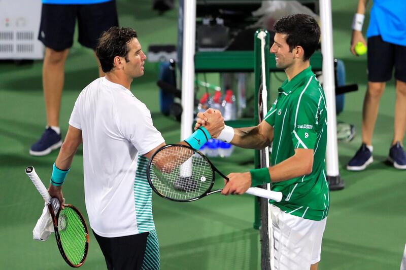 Novak Djokovic shakes hands with Malek Jaziri after their match. Reuters