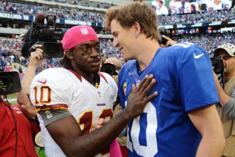 Washington's Robert Griffin III greets Eli Manning after the match with the New York Giants.