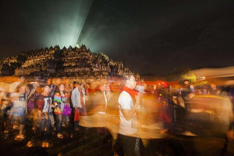 Hundreds of Buddhist monks and devotees celebrate Vesak Day in ancient Borobudur temple which is decorated with 72 Buddha statues in Magelang, Central Java province as Indonesia's religious minority celebrate Buddhist day. Buddhists are celebrating Vesak, which commemorates the birth of Buddha, his attaining enlightenment and his passing away on the full moon day of May. AFP Photo

