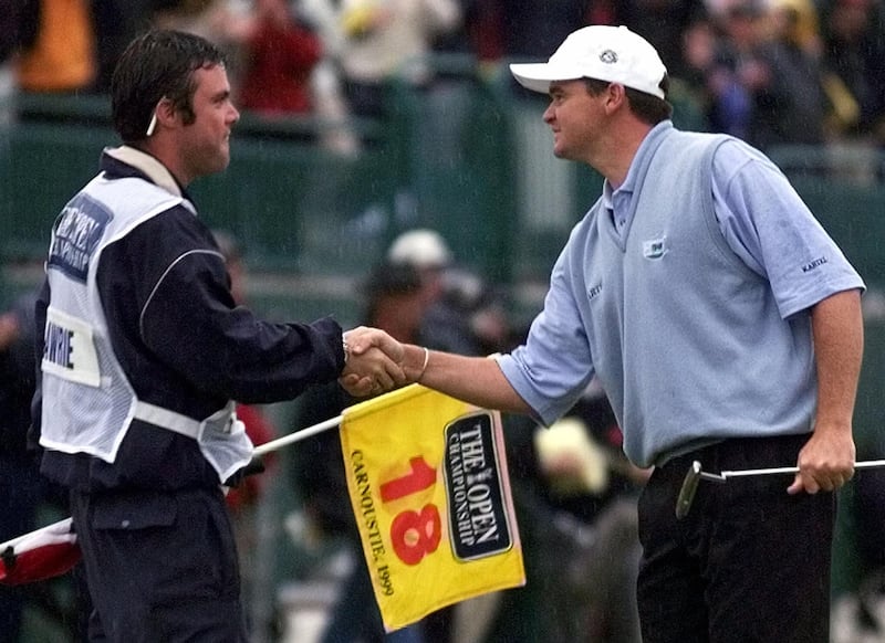 Scotland's Paul  Lawrie shakes hands with his caddie after winning the 128th Open Championship in a three-way playoff at Carnoustie, Scotland, Sunday, July 18, 1999.  (AP Photo/Adam Butler)