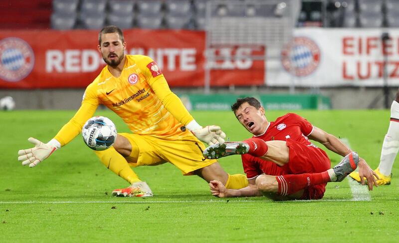 Bayern's Robert Lewandowski in action with Eintracht Frankfurt's Kevin Trapp. Reuters