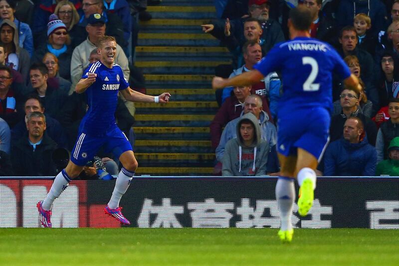 BURNLEY, ENGLAND - AUGUST 18:  Andre Schurrle of Chelsea celebrates scoring their second goal with Branislav Ivanovic of Chelsea during the Barclays Premier League match between Burnley and Chelsea at Turf Moor on August 18, 2014 in Burnley, England.  (Photo by Clive Brunskill/Getty Images)