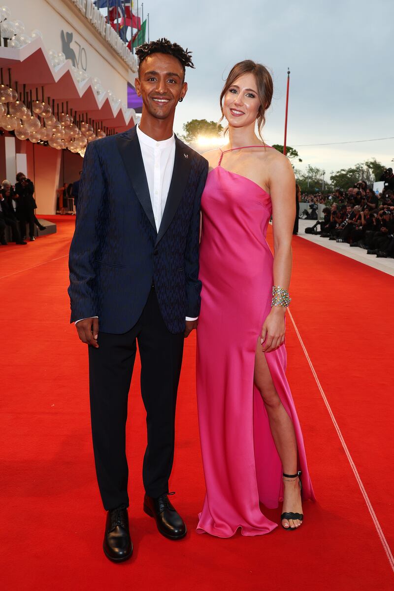 Italian athlete Yeman Crippa, in a suit and white T-shirt, and Sofia Filippi, in a pink satin gown. Getty Images
