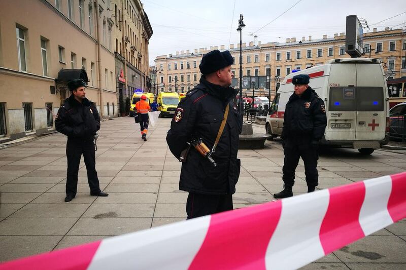 Police officers guard the area at the entrance to the Technological Institute metro station in St Petersburg after a blast hit the metro system. Ruslan Shamukov / AFP